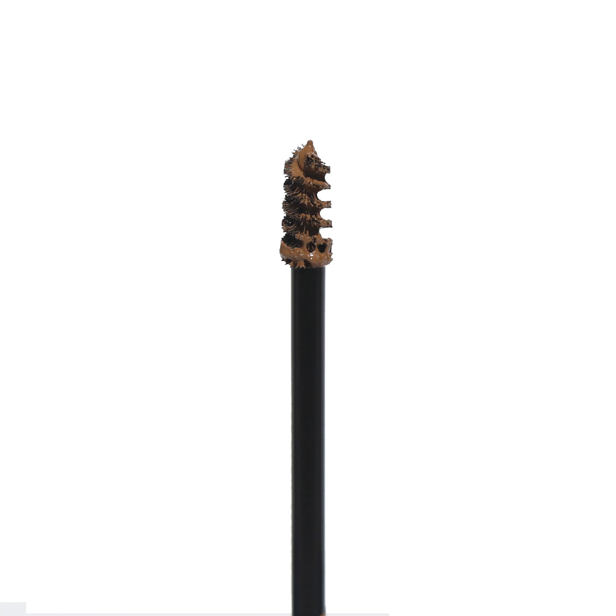 Close-up of Get-Fluffed Brow Gel spoolie with product, ready to tame and tint eyebrows.