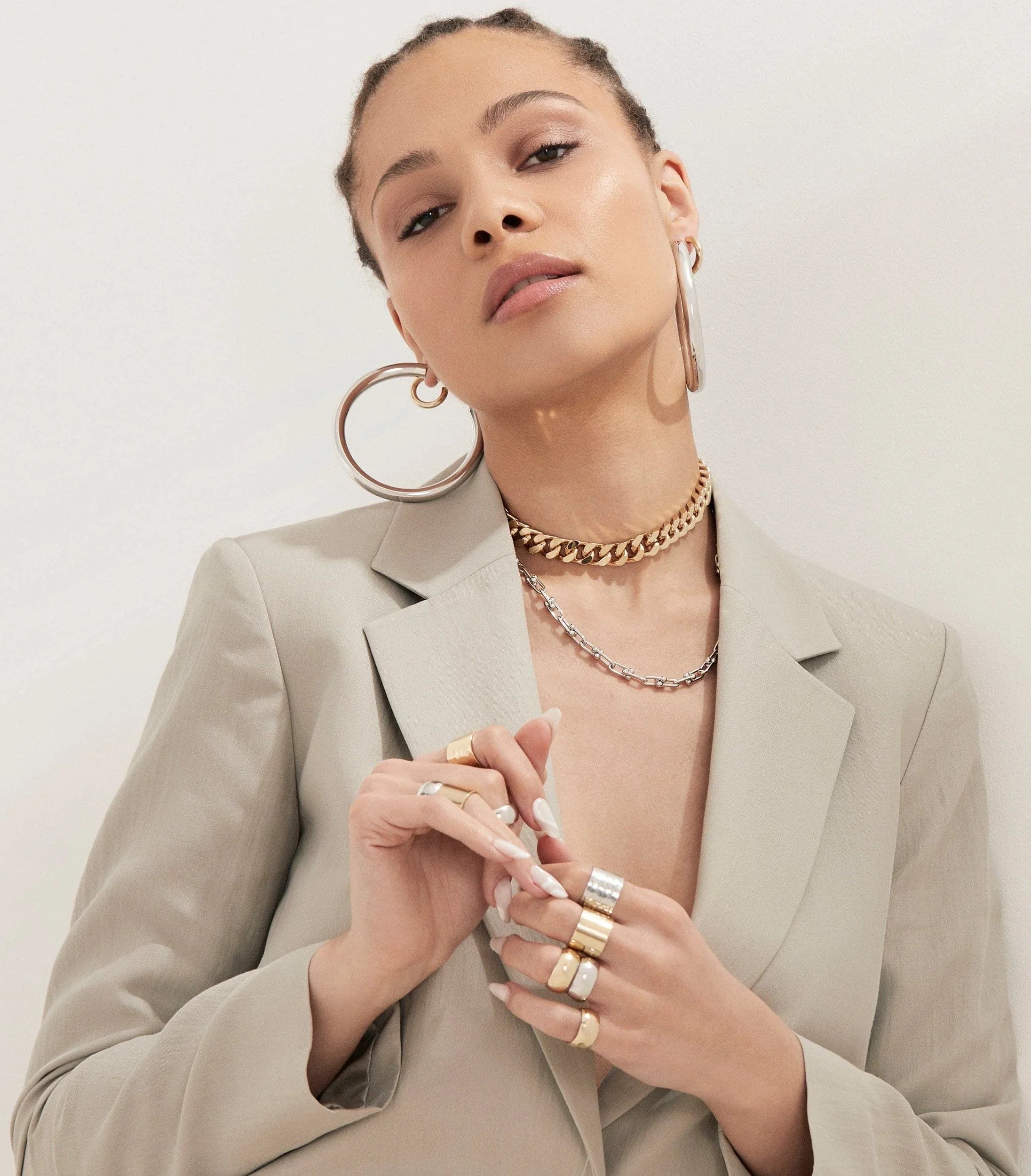 Woman in a blazer showing off 2.5 inch Ryan Hoops jewelry earrings