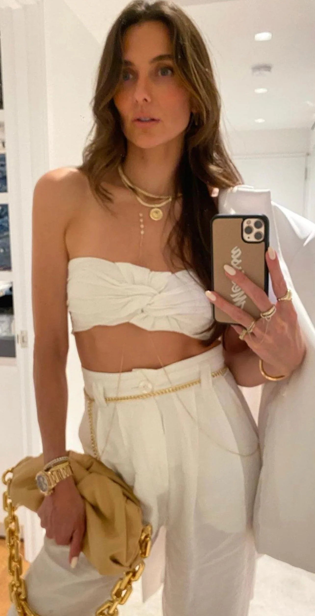 Stylish woman in white outfit wearing the Melissa Pendant Necklace pop of sparkle