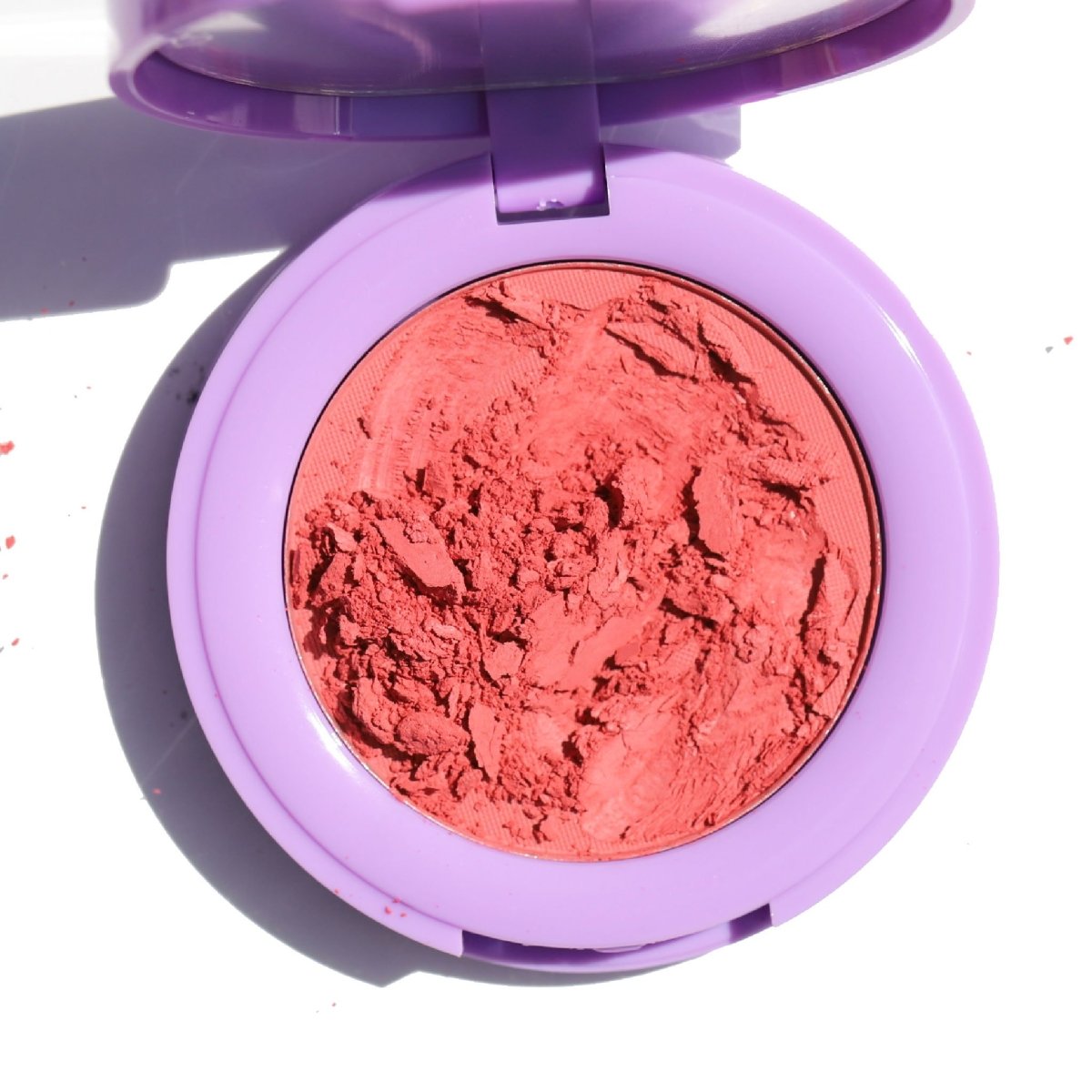 open purple compact with crushed orange blush - In Bloom Powder Blush, freshly squeezed - Half Caked