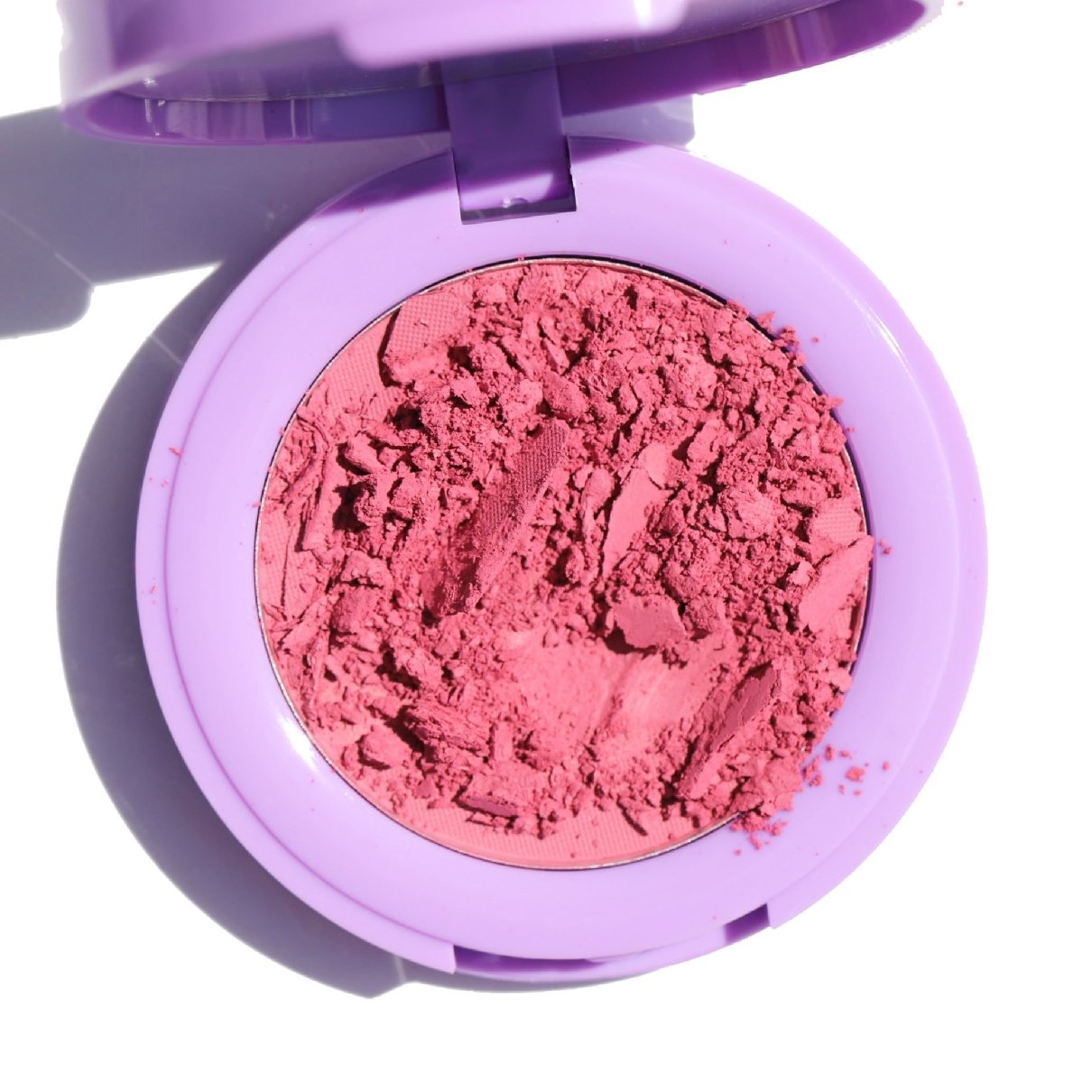 open purple compact with crushed pink pan - In Bloom Powder Blush, soft serve - Half Caked