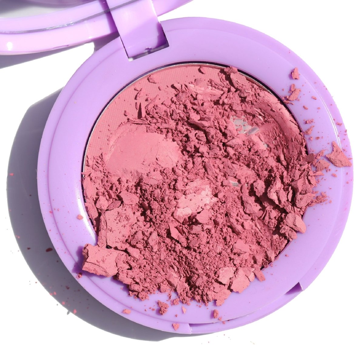 open purple compact with crushed pink blush - In Bloom Powder Blush, bunny - Half Caked