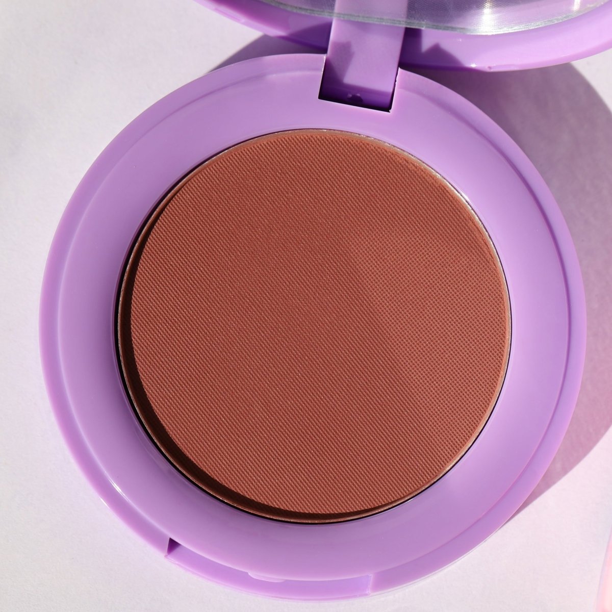 purple compact with brown pan - In Bloom Powder Blush, day 'n' nite - Half Caked