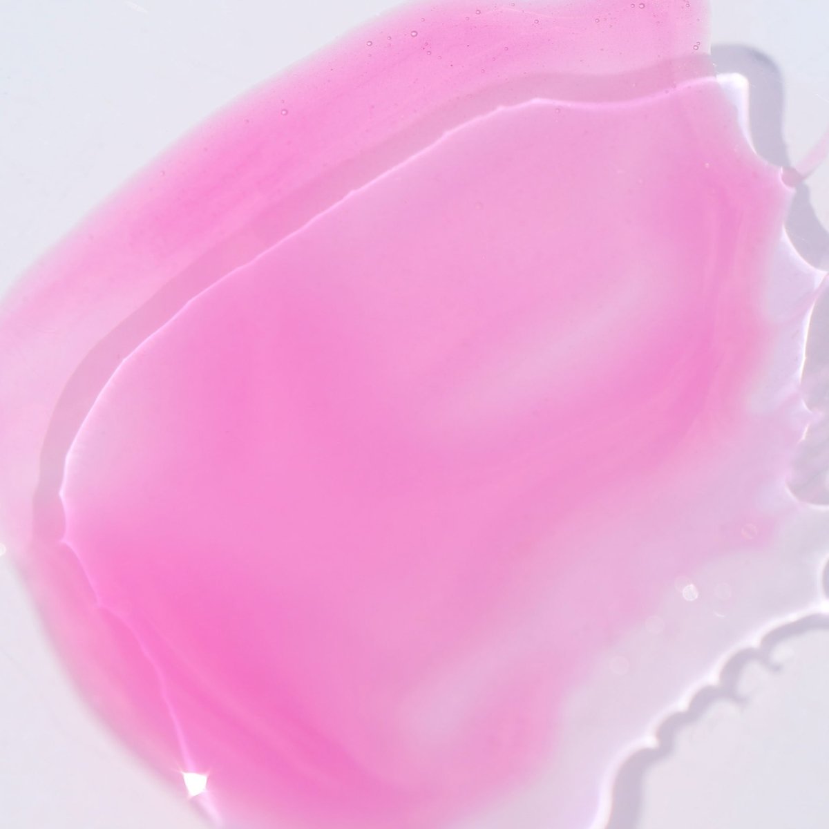 Swatch of sheer candy pink gloss - Instant Crush - Dirty Pop - Half Caked