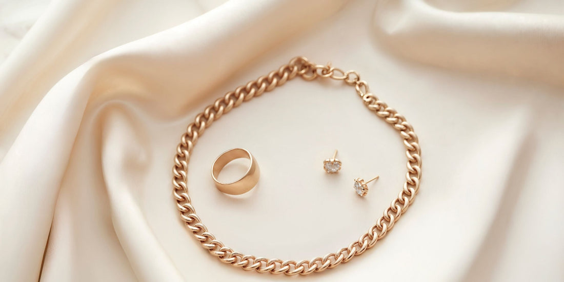 Collection of timeless investment jewelry pieces including hoops, pendant necklace and diamond bracelet