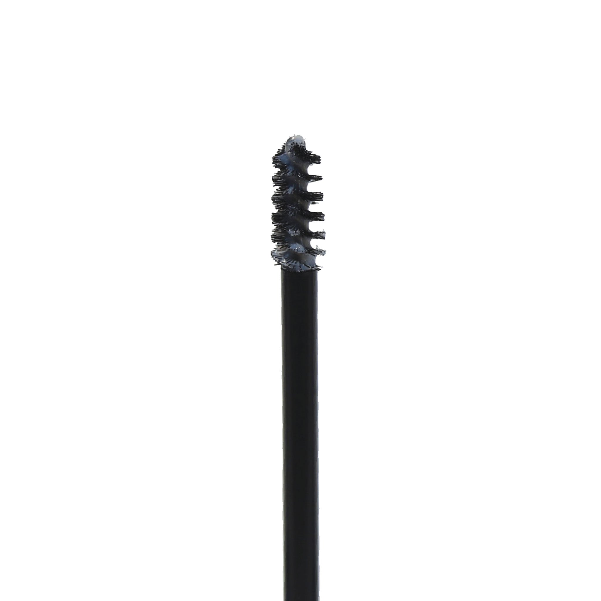 Close-up of the mini spoolie wand of Get-Fluffed Brow Gel, coated with tinted brow gel, ready to shape and set your eyebrows.