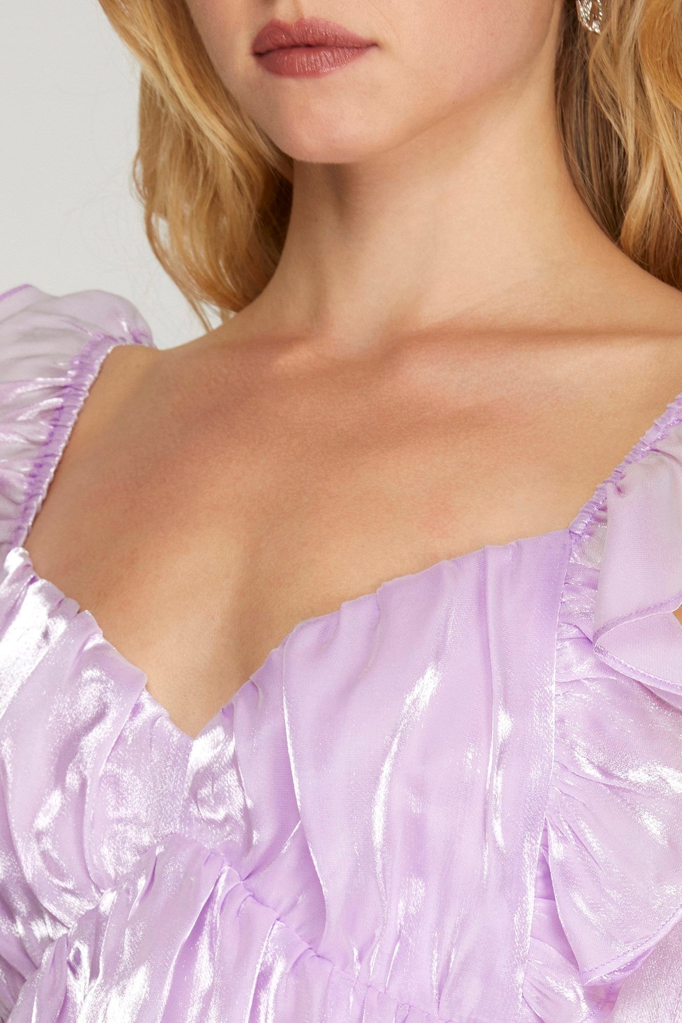 Shiny mini dress with back bow detail