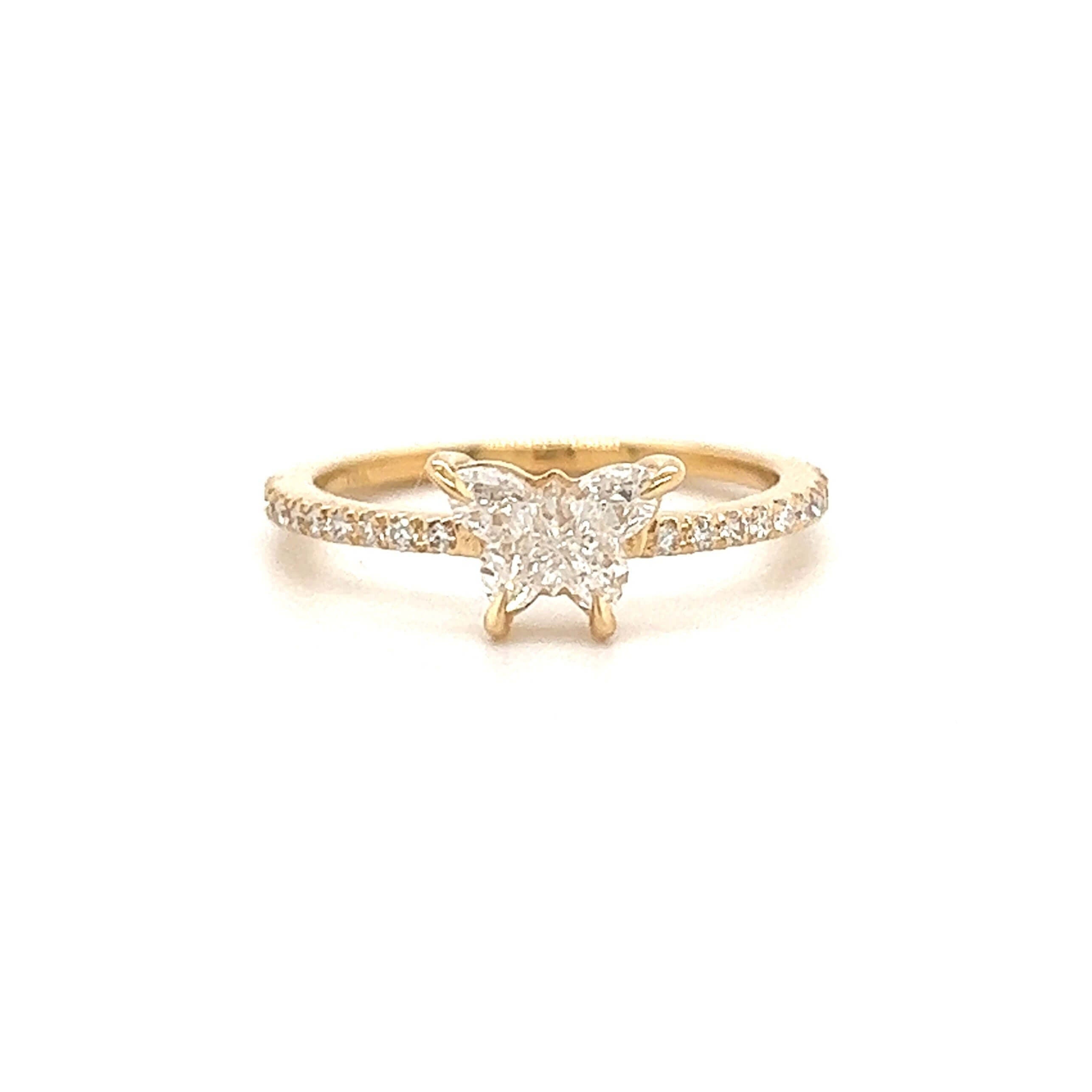 Elegant butterfly diamond ring in gold with pavé band from our luxury jewelry collection.