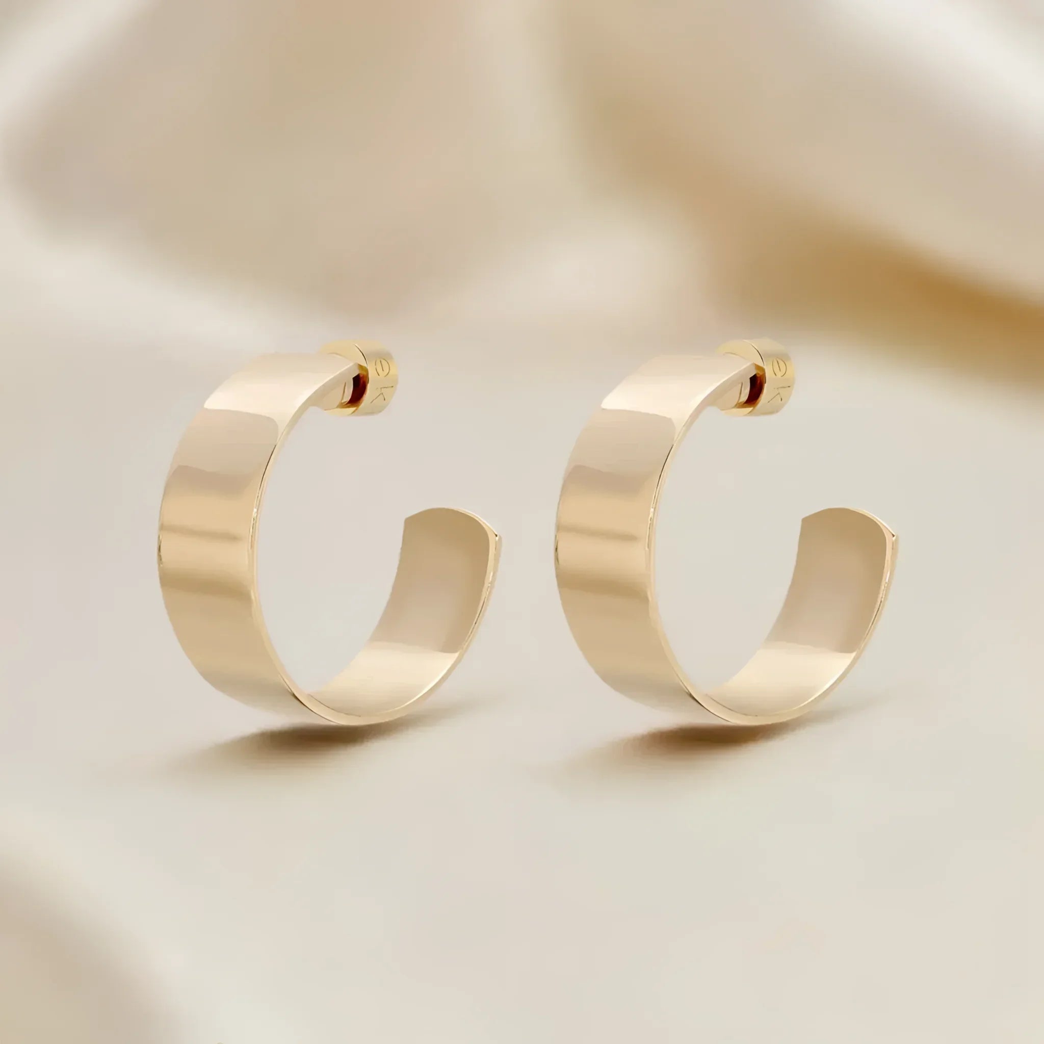 Gold hoop earrings shown in the 1 Skylar Hoops product photo