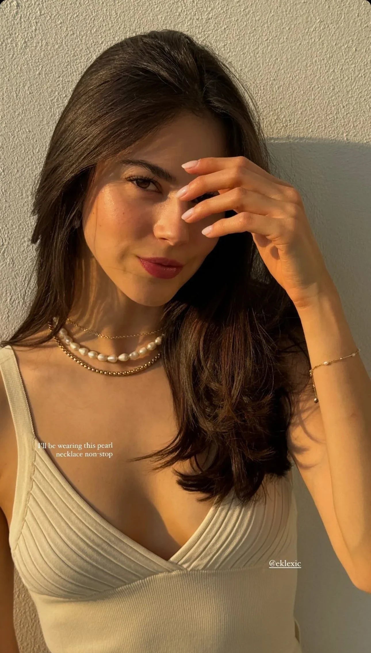 Woman wearing gorgeous pearl and gold necklaces from the Luciana Box Chain Necklace collection
