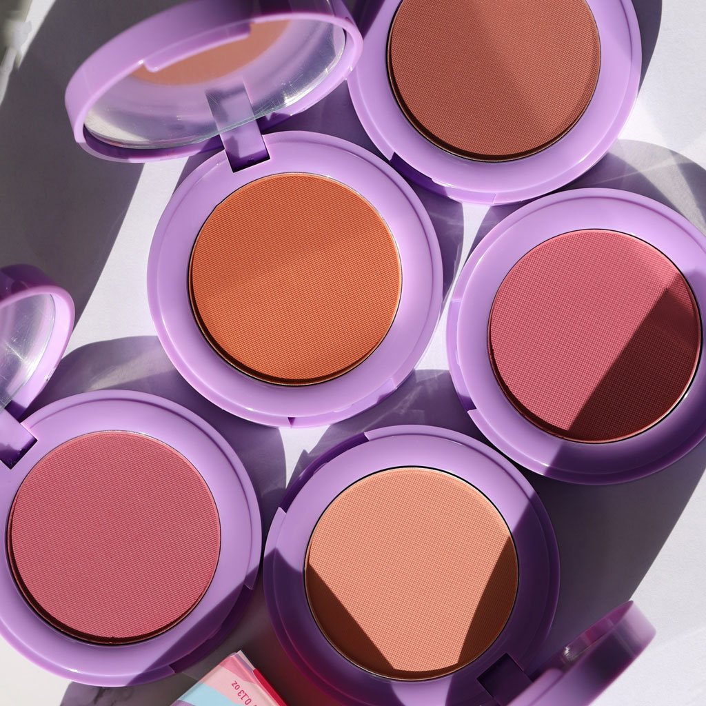 open purple compacts with brown orange and pink pans - In Bloom Powder Blush - Half Caked