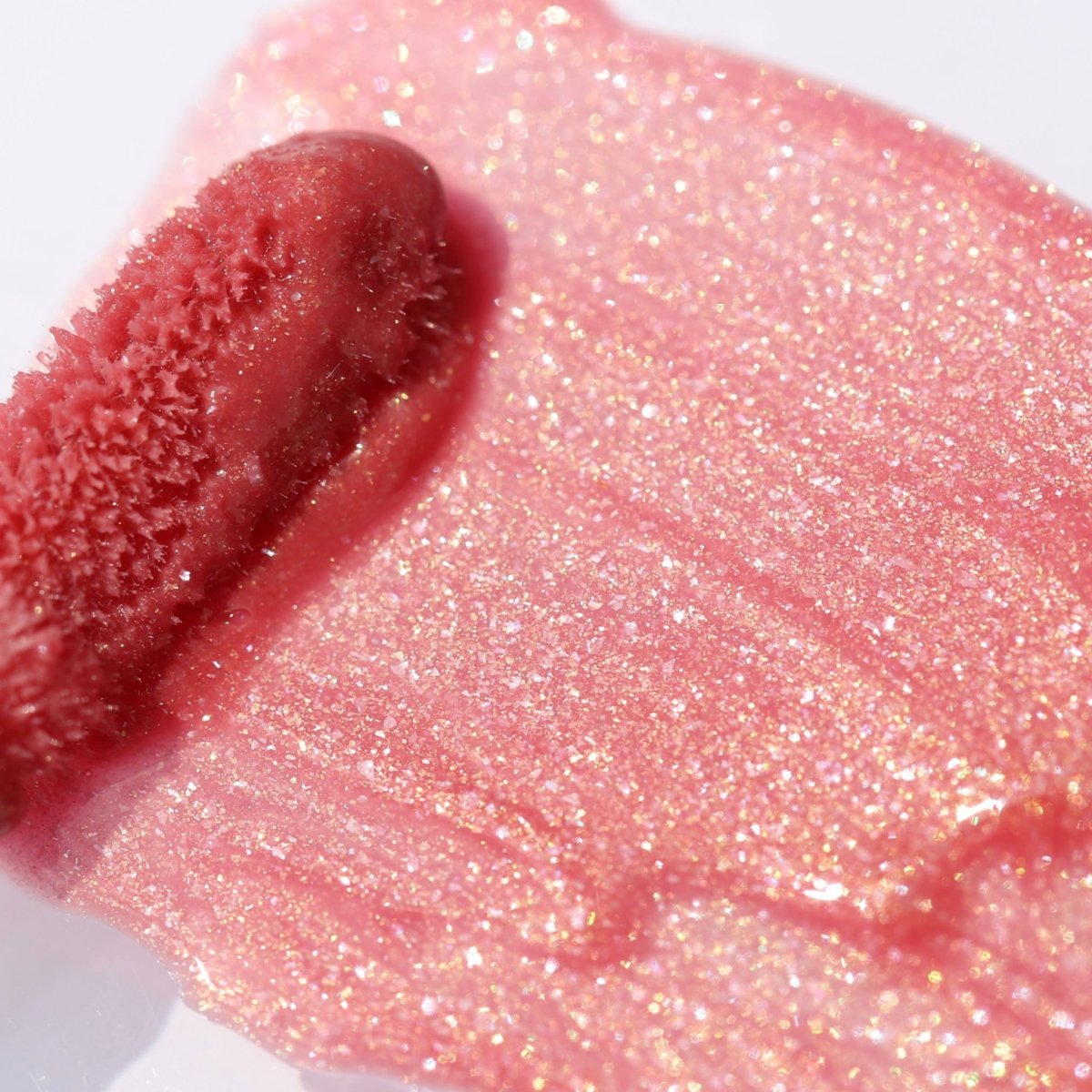 Lip swatch application of rosy pink lip gloss with gold shimmer - Instant Crush - Lucky Charm - Half Caked