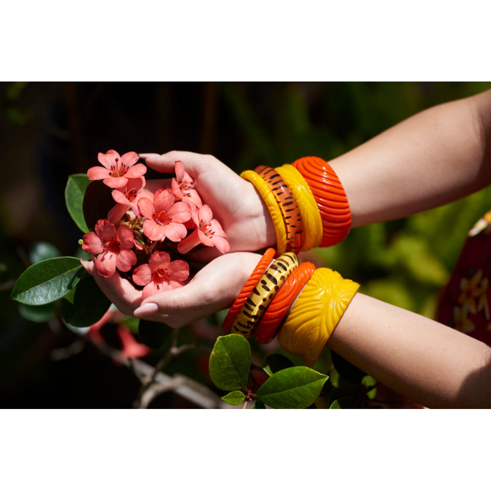 Wide Papaya Heavy Carve Fakelite Bangle by Splendette